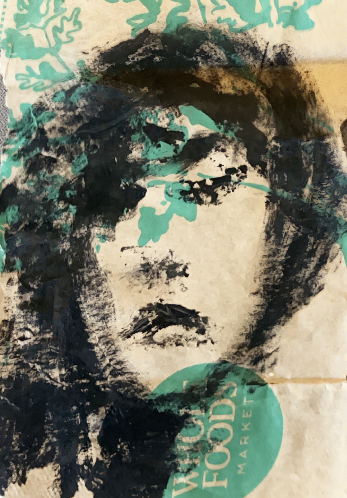 Face monoprint on paper bag