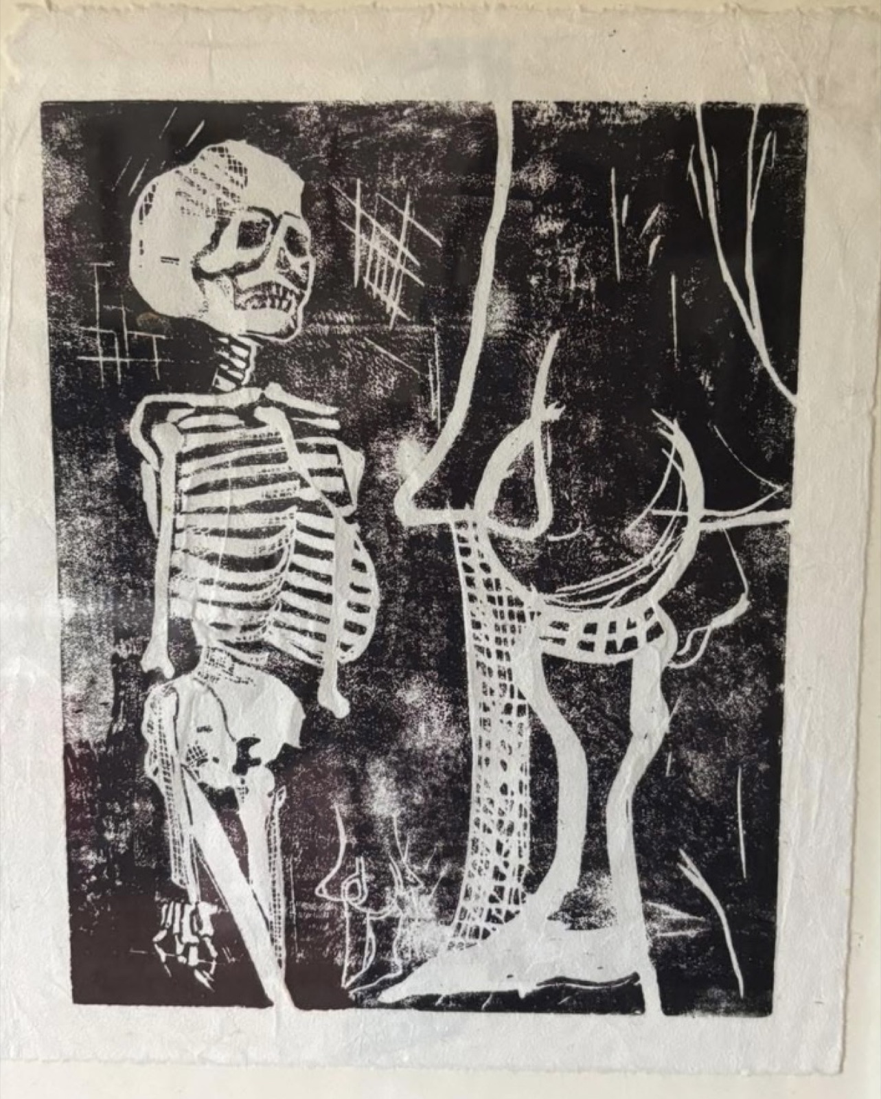 Skeleton and figure linocut